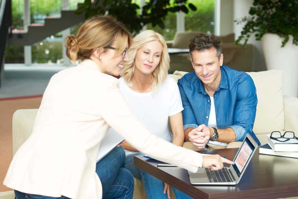 People looking at laptop